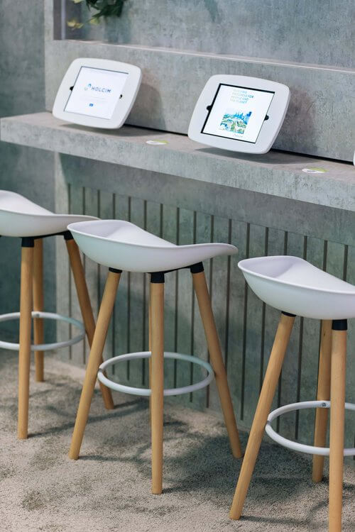Holcim up close to chairs and tablets