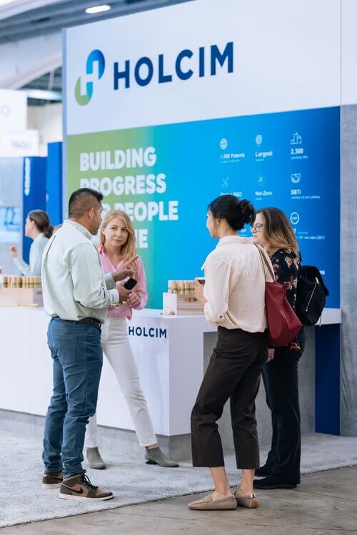Holcim people standing at stand
