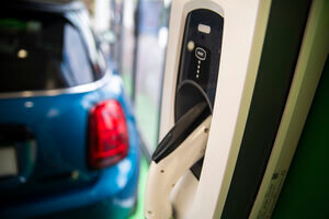 Close up of OVO electric charging a mini