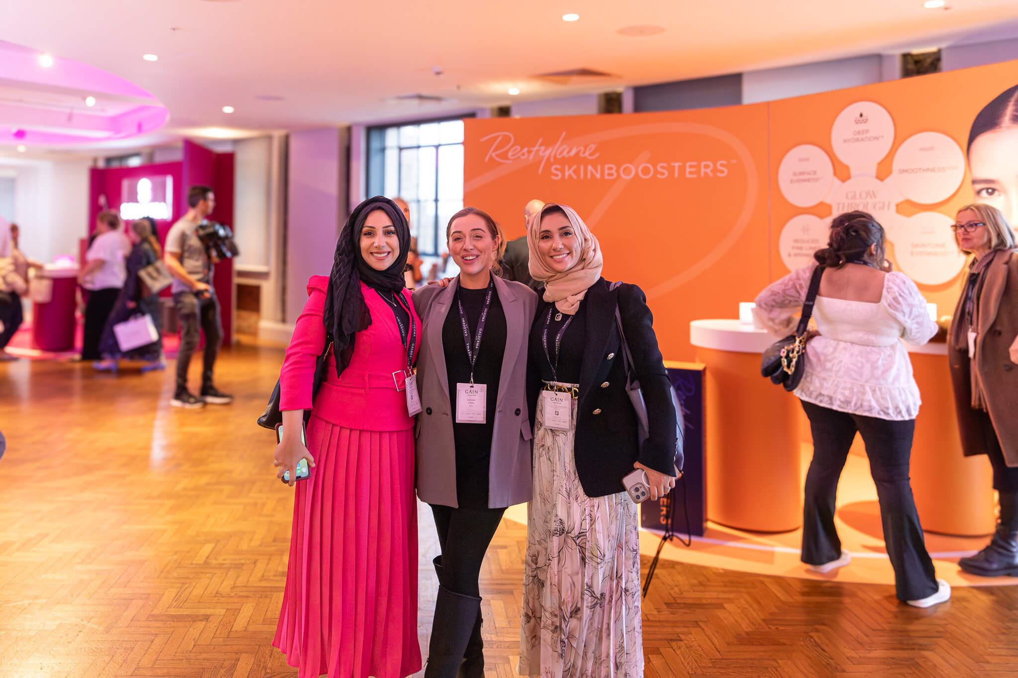 3 girls posing for picture at the event