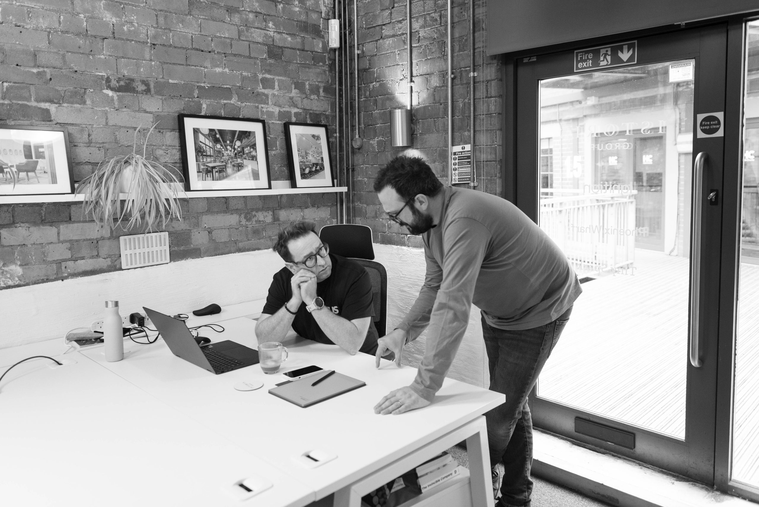 Phil & Mark chatting at their desk