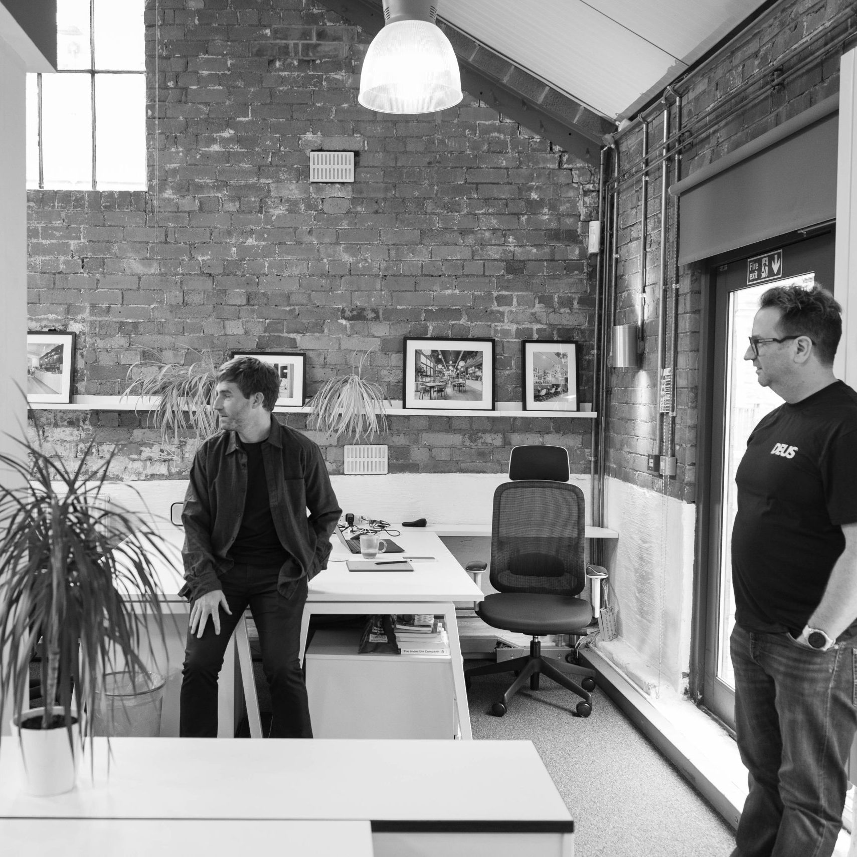 Bryn and Tom chatting in the office